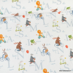 Tissu jersey motif animaux faisant du vélo fond blanc