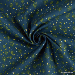 Tissu coton popeline motifs arbres et feuilles fond bleu