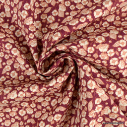 Tissu coton popeline motifs fleurs fond bordeaux