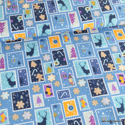 Tissu de Noël motif timbres et flocons fond bleu - Oeko tex