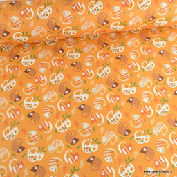 Tissu coton Enduit motif cameléons fond orange
