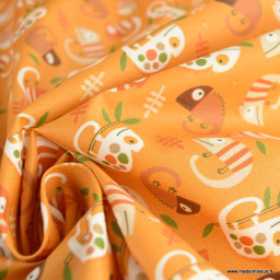 Tissu coton Enduit motif caméléons fond orange
