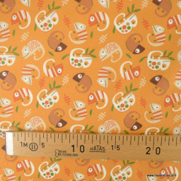 Tissu coton Enduit motif caméléons fond orange