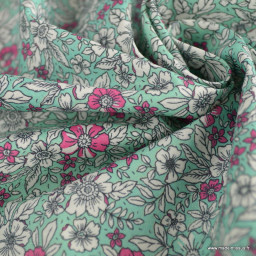 Tissu coton Enduit motif fleurs roses fond turquoise