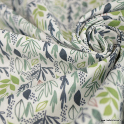 Tissu coton Lion motif petites feuilles exotiques vertes fond blanc