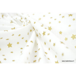 Tissu coton imprimé dessin étoiles vieil or sur fond blanc