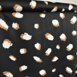 Tissu Satin de viscose motif leopard camel fond Noir