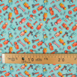 Tissu coton motif esprit Lego mécaniciens – Fond bleu clair