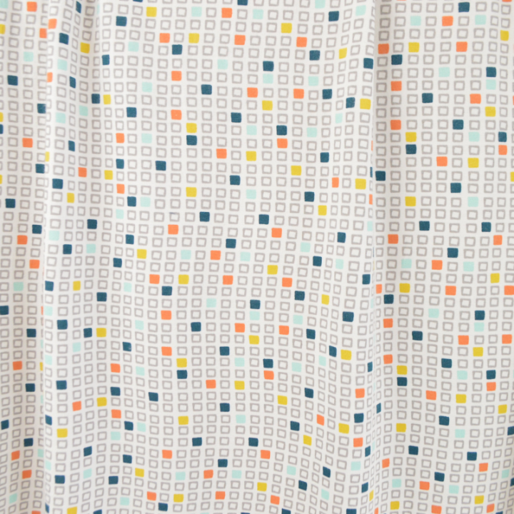 Tissu jersey à motifs cubes géométriques colorés – Idéal pour vêtements confortables