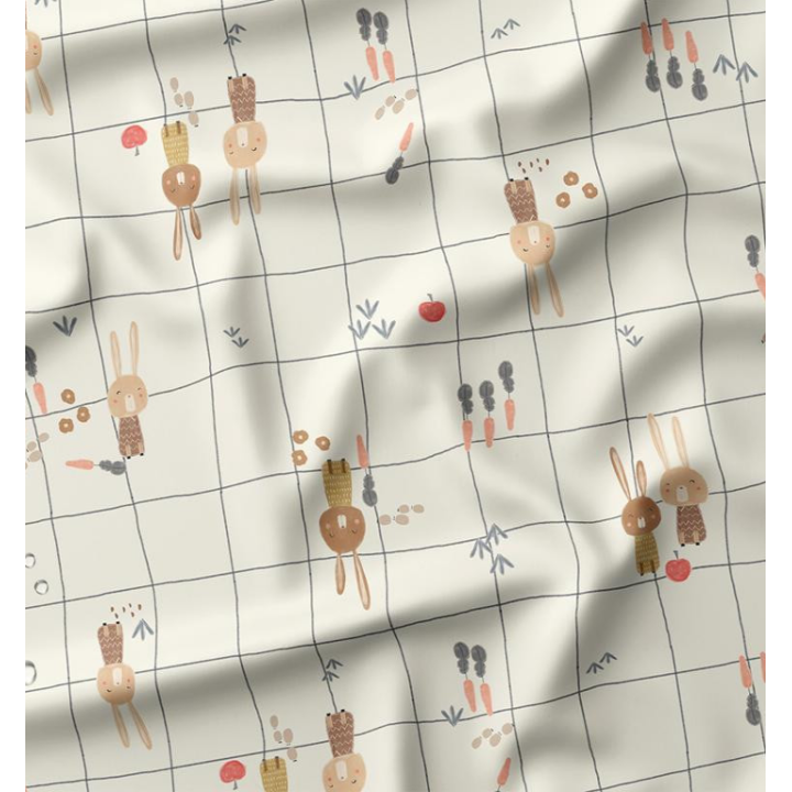 Tissu imperméable Ilapio type ciré motif lapins fond écru