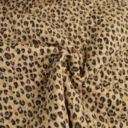 Tissu double gaze de coton matelassé léopard beige envers noir