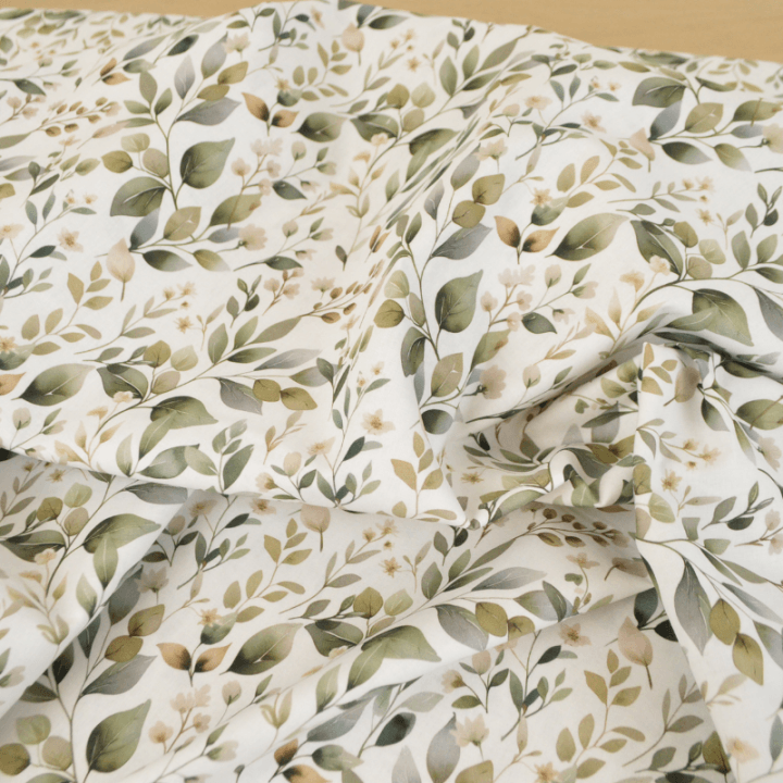 Tissu cretonne coton Luara feuillage vert fond blanc
