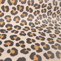 Tissu imperméable type ciré motif léopard fond écru